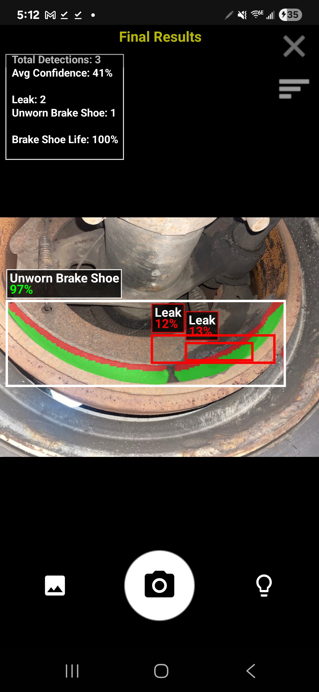 Technician capturing brake shoe maintenance photo with InSpec mobile app