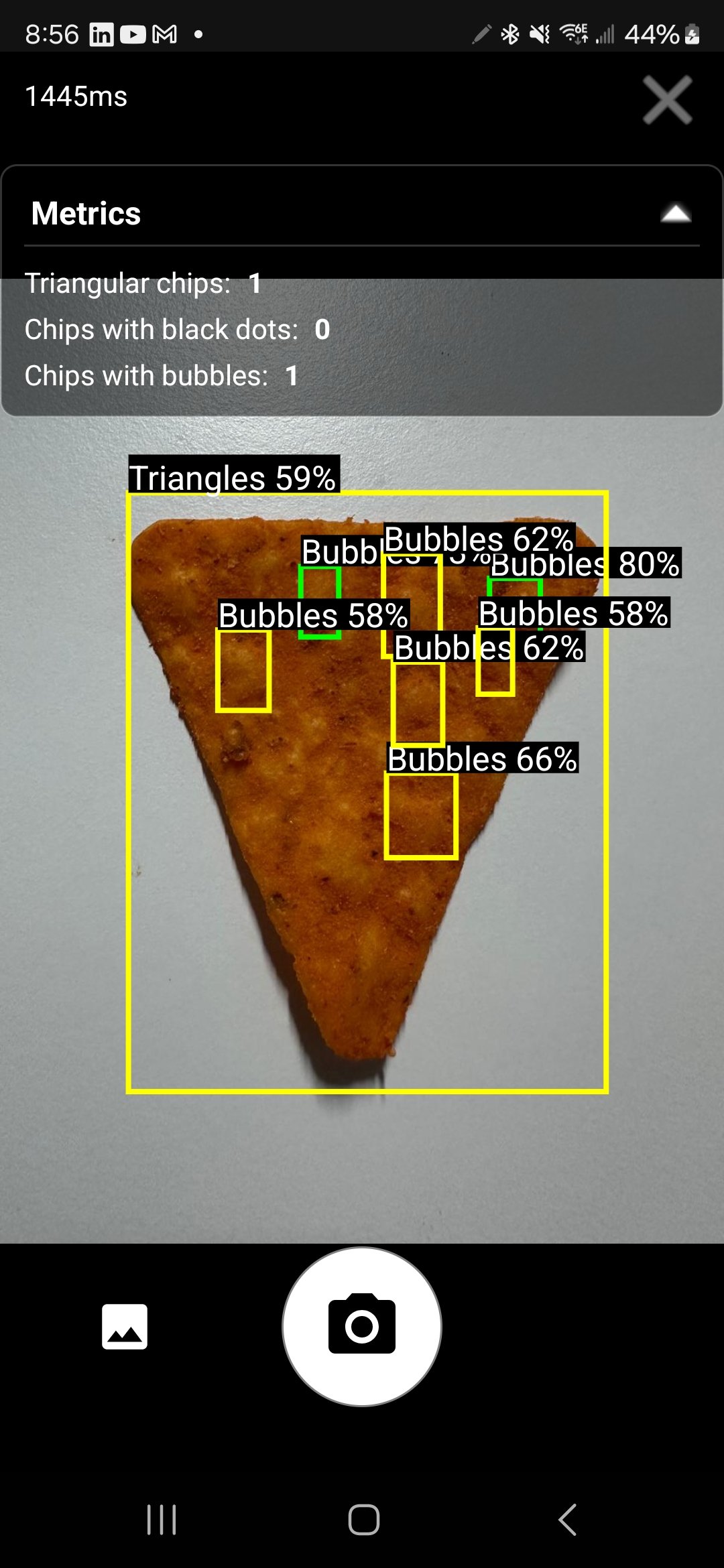 Single potato chip under visual inspection for food manufacturing quality